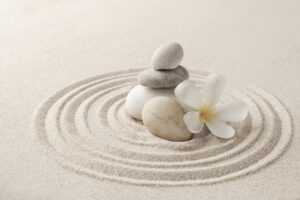 Stacked zen stones sand background art of balance concept
